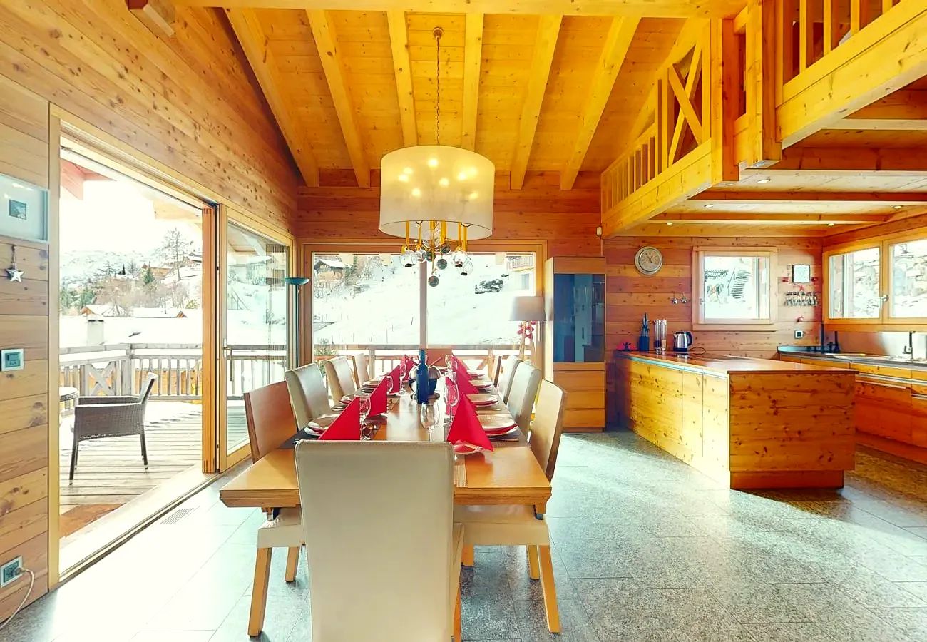 Table laid for 12, with the kitchen behind
