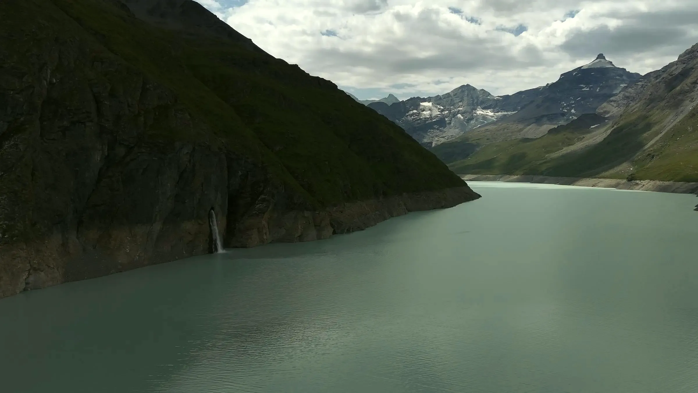 Lac des Dix behind the Grande Dixence dam, our own drone photo, July 2026